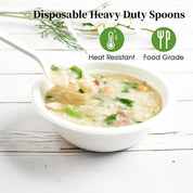 A disposable heavy-duty spoon scoops steaming porridge from a bowl, showcasing its heat-resistant and food-grade properties.