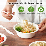 A hand holds a compostable fork, lifting noodles from a biodegradable bowl filled with vegetables, emphasizing eco-friendly dining.
