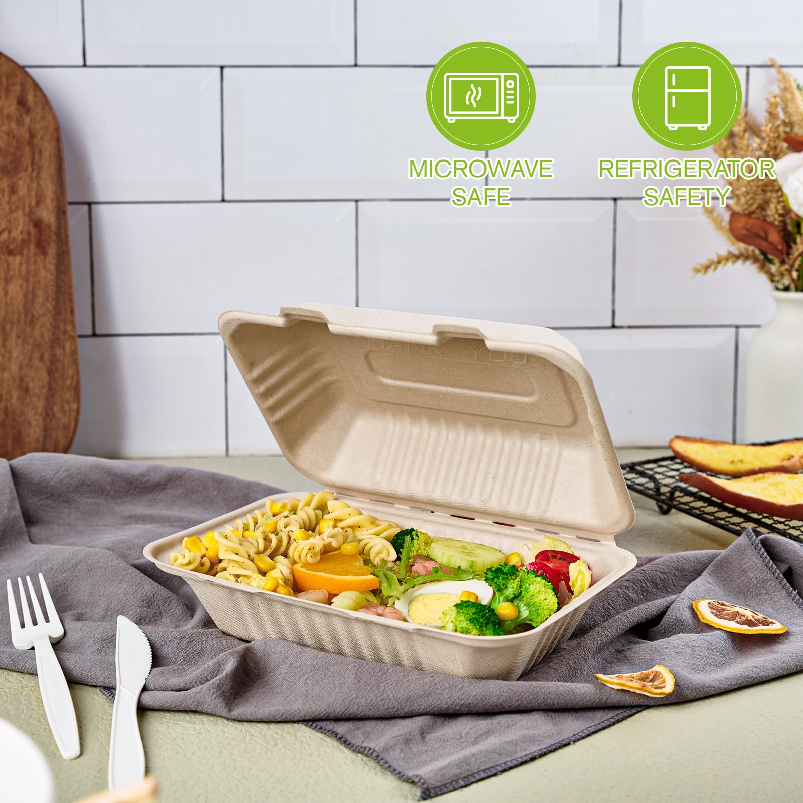 A biodegradable takeout container filled with colorful pasta and vegetables, set on a table with green safety icons for microwave and fridge use.