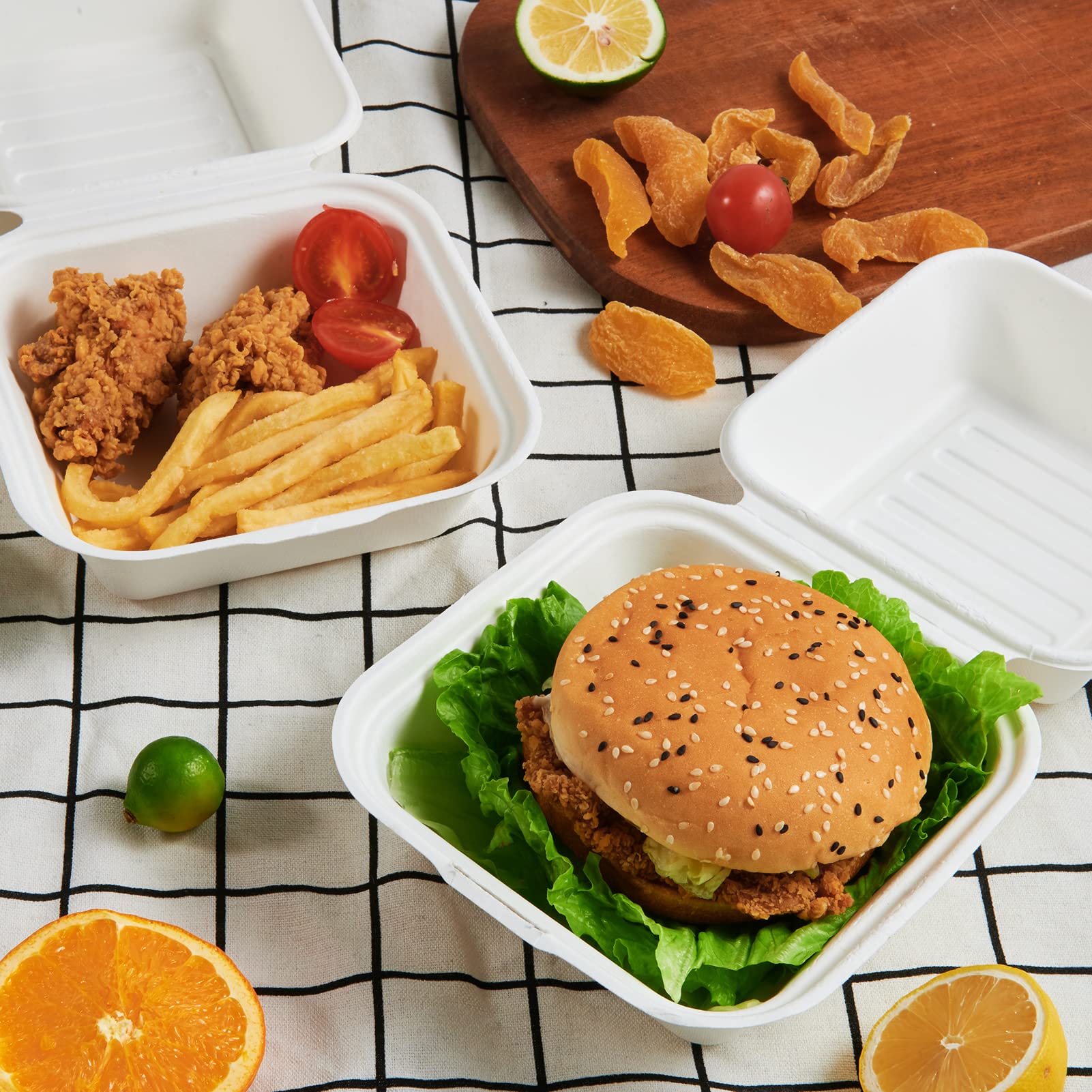 ECOLipak disposable take - out food containers, perfect for packing a burger, fried chicken, fries, and fresh fruits.
