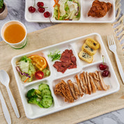 Ecolipak white compartment tray filled with assorted foods.