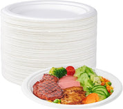 A stack of white disposable plates next to a plate featuring grilled steak, vegetables, and ham, ready for a meal.