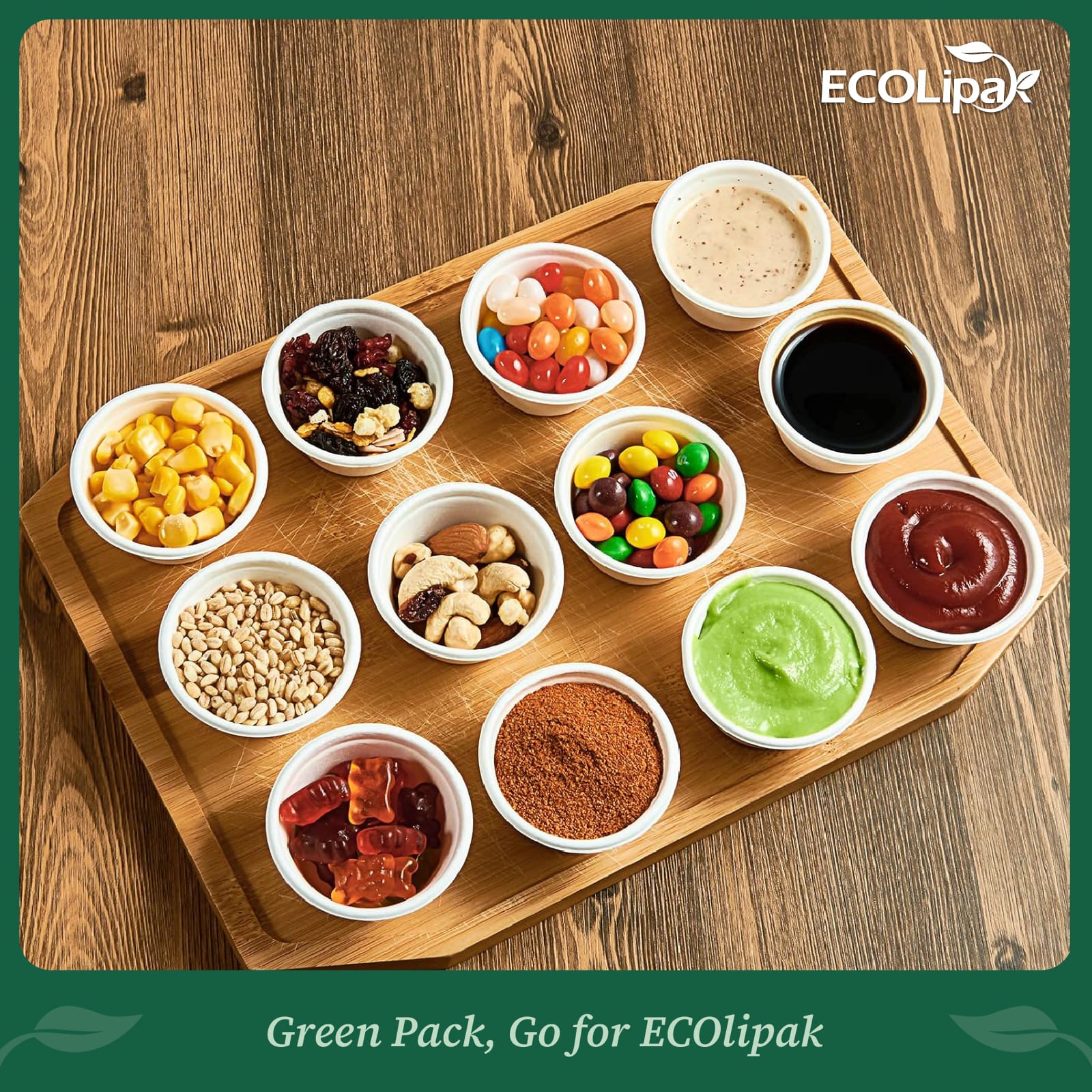 A wooden platter displays ten small cups filled with various snacks, candies, sauces, and toppings, showcasing a colorful assortment.