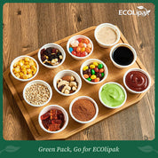 A wooden platter displays ten small cups filled with various snacks, candies, sauces, and toppings, showcasing a colorful assortment.