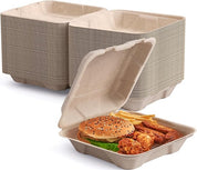 Stack of eco-friendly food containers beside an open box filled with a burger, fries, and chicken wings.