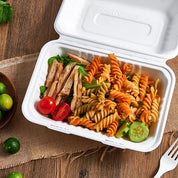 ECOLipak disposable take - out food container holding a delicious meal of pasta salad with grilled chicken and vegetables.