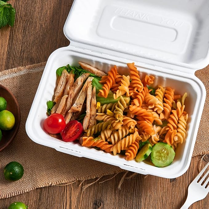 ECOLipak disposable take - out food container holding a delicious meal of pasta salad with grilled chicken and vegetables.