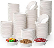 A variety of stacked white cups and bowls, with small dishes holding jellybeans, brown sugar, and ketchup in the foreground.