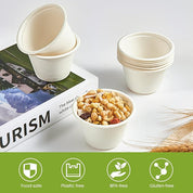 A stack of eco-friendly, food-safe cups, one filled with snack mix, beside a book titled "Tourism", showcasing sustainability icons.