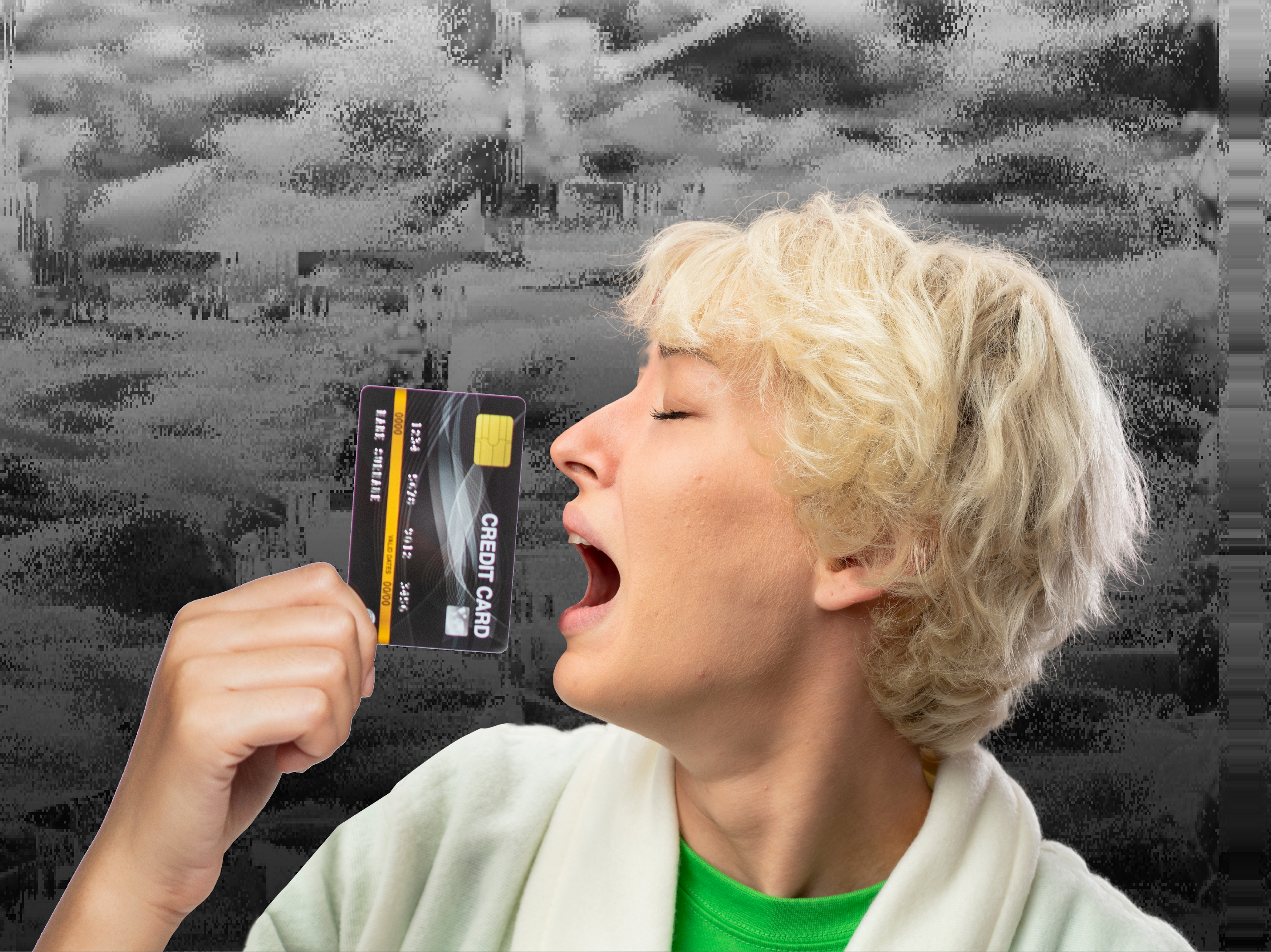 A person holds a credit card close to their face, dressed in a white robe and a green shirt, with a textured gray background.